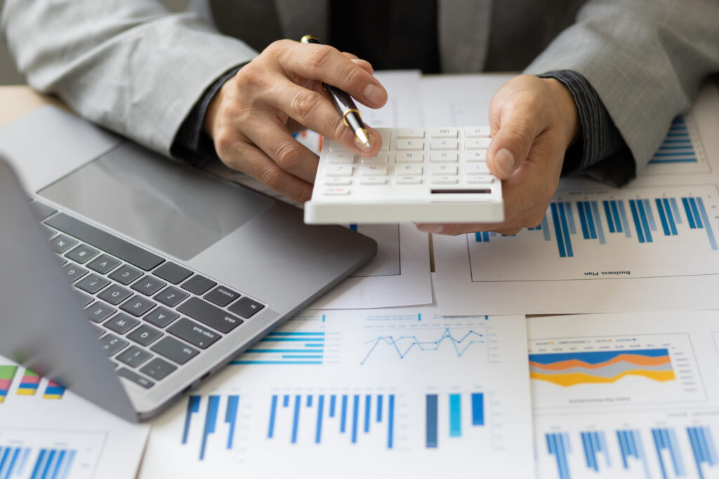 Calculation and analysis of financial statement accounting data on the desk. financial concept tax system and budget allocation.