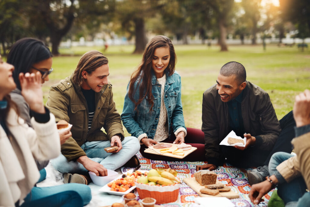 a group of friends enjoy a picnic on a sunny day