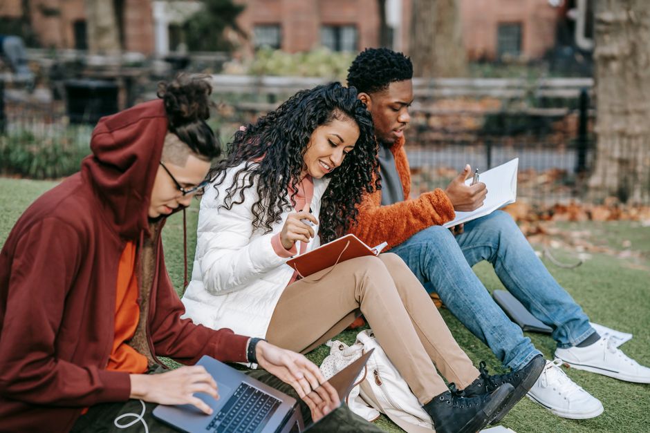 diverse group of students collaborating on a modern college campus - higher education marketing agency ri